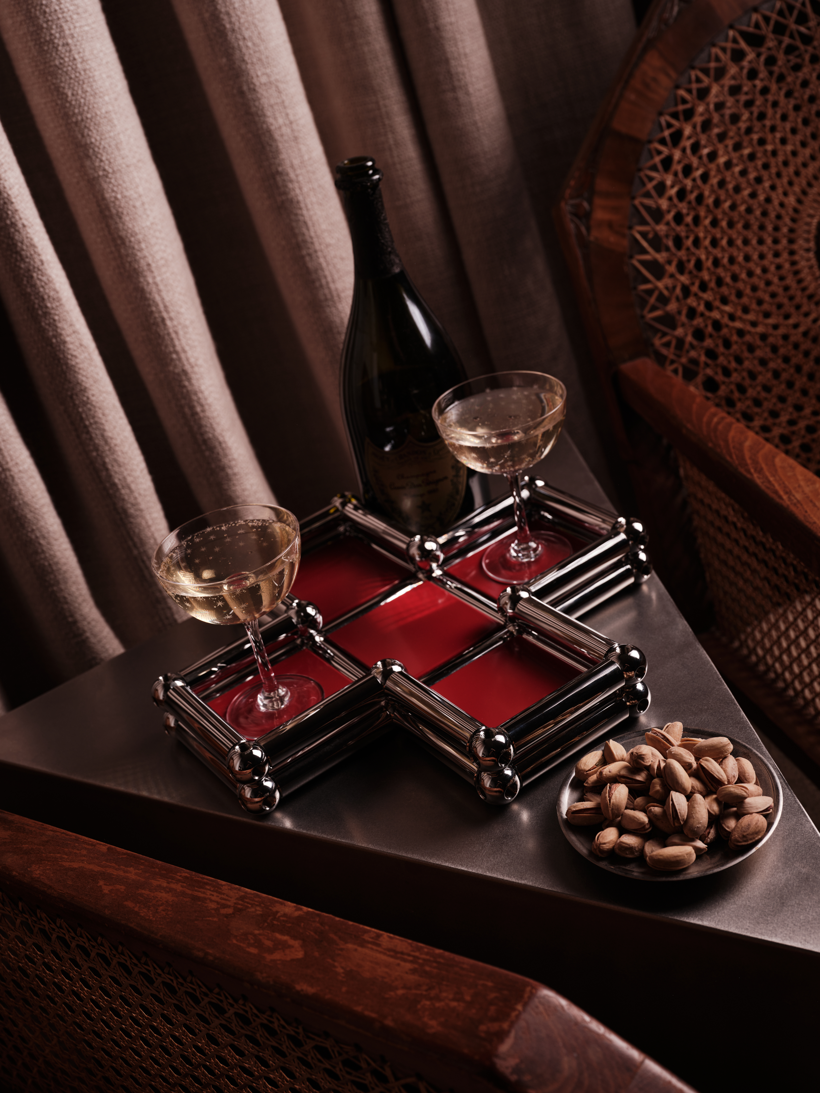 A series of shots depicting a festive Christmas tree, flowers, candles, and accessories setup.