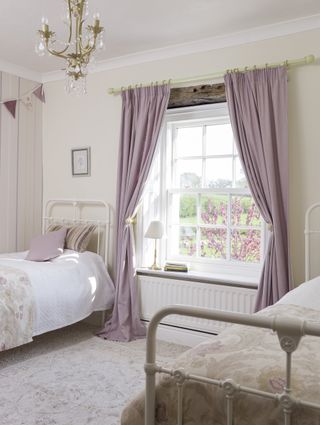 Bedroom with lilac curtains