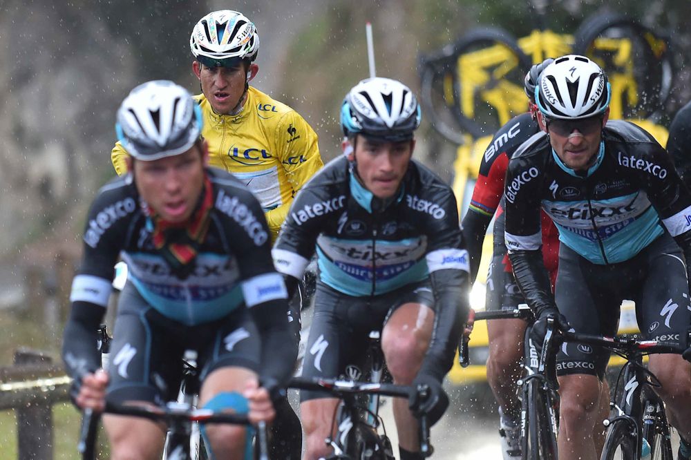 Michal Kwiatkowski surrounded by teammates.
