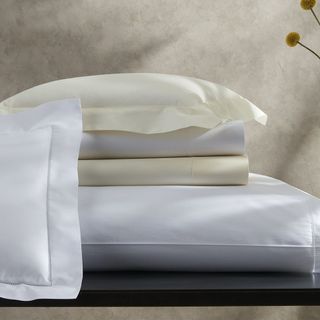 Sierra Hemstitch bedding collection on a counter.