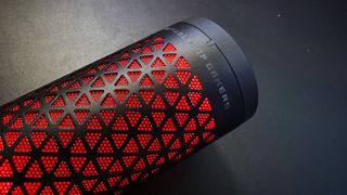 Asus ROG Carnyx review image showing the microphone's red mute lighting