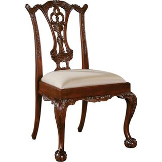 A carved wooden dining chair from Wayfair