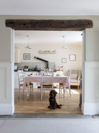 opening with beam through to traditional kitchen