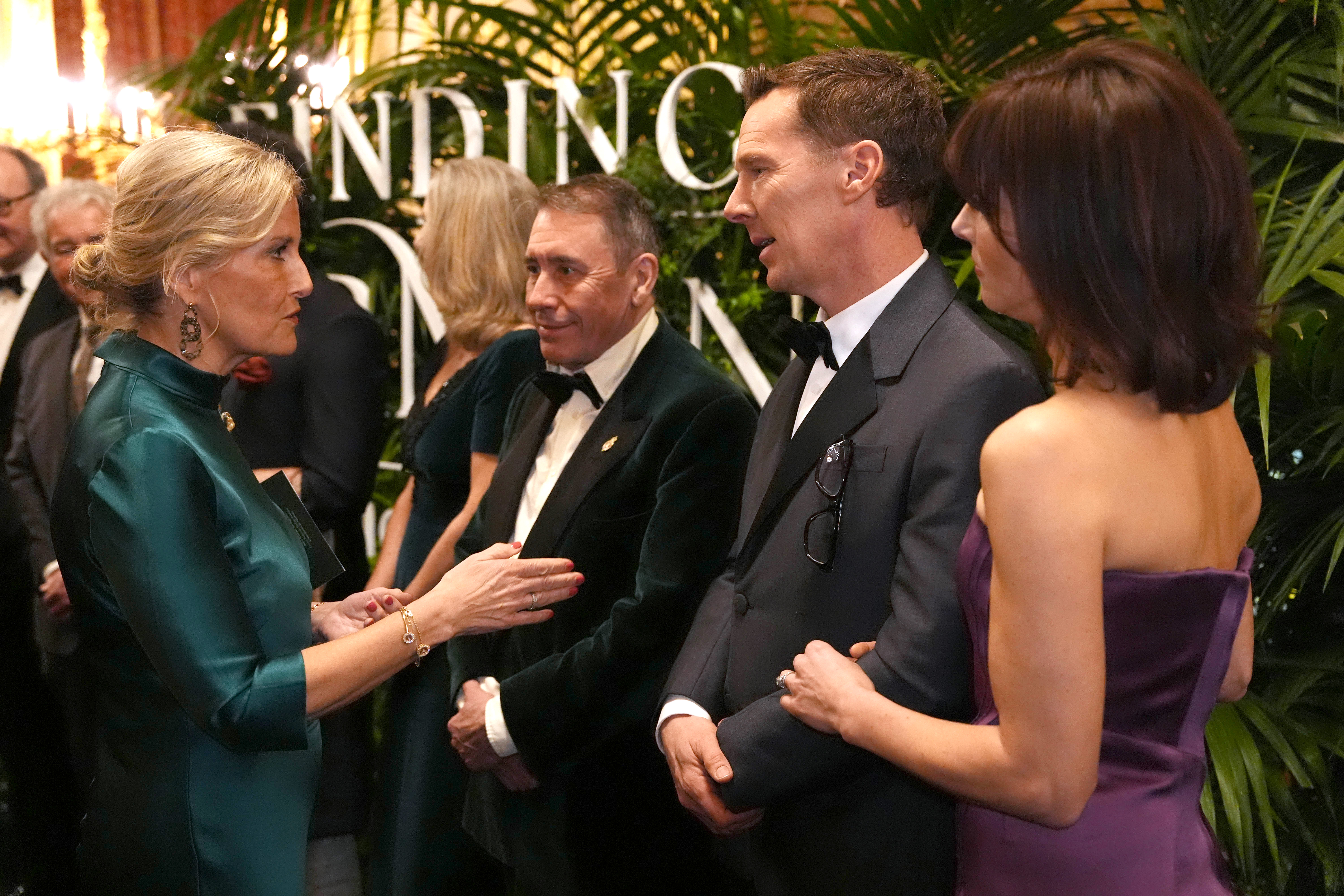 The Duchess of Edinburgh speaks to Jools Holland, Benedict Cumberbatch and Sophie Hunter in the Grand Reception Room after they attended the premiere of Prime Video's Finding Harmony: A King's Vision, at Windsor Castle in Berkshire.