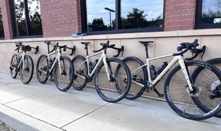 A line of Enve's MOG gravel bikes leaning against a build