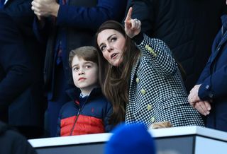 Catherine, Duchess of Cambridge speaks to Prince George of Cambridge prior to the Guinness Six Nations Rugby match