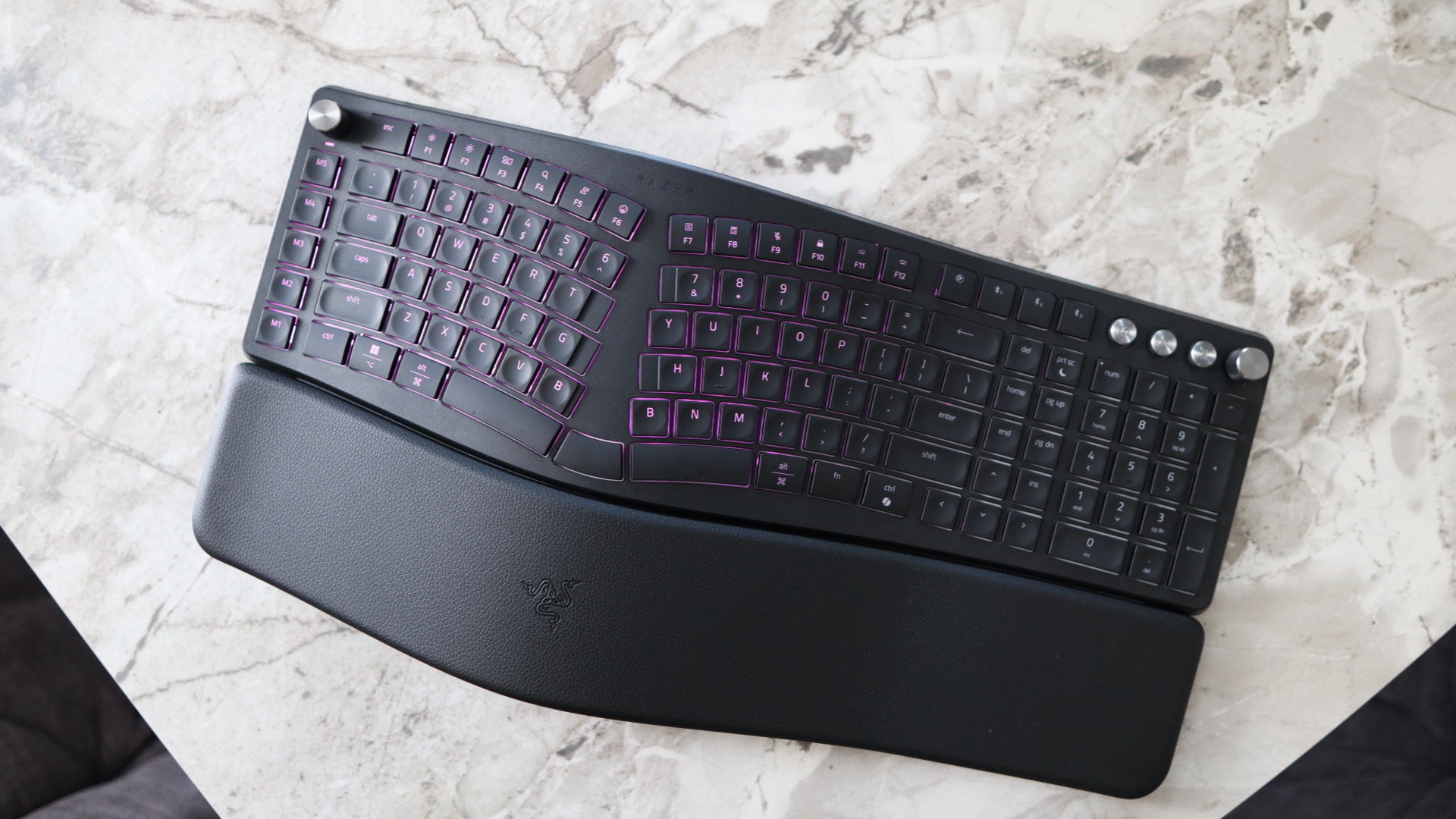 Razer Pro Type Ergo ergonomic keyboard on marble surface