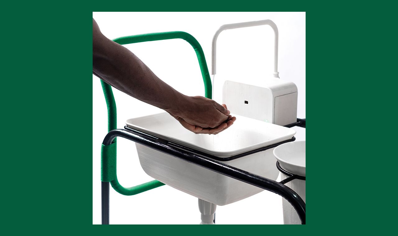 A man washing his hands at a NMBello Studio Portable Washing Station