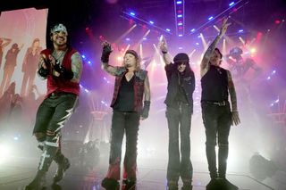 A picture of Motley Crue, with Mick Mars, on stage