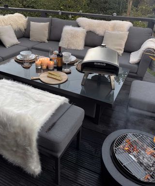 sofa area with fire pit and grill