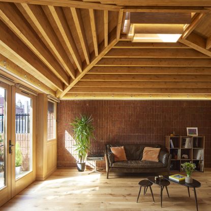 london's haringey brick bungalow house interior showing living space with exposed brick