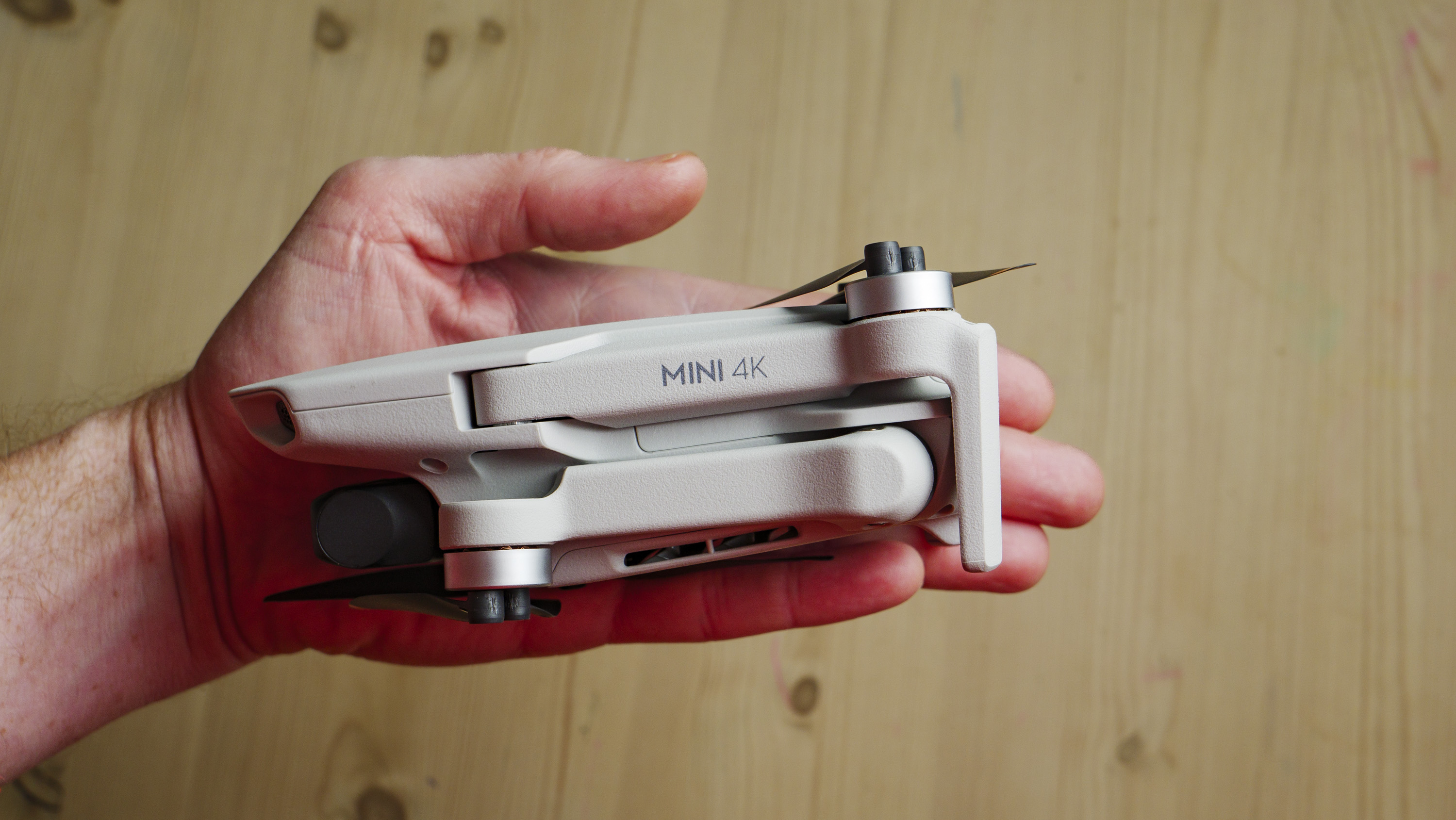 DJI Mini 4K beginner drone folded away and in the hand