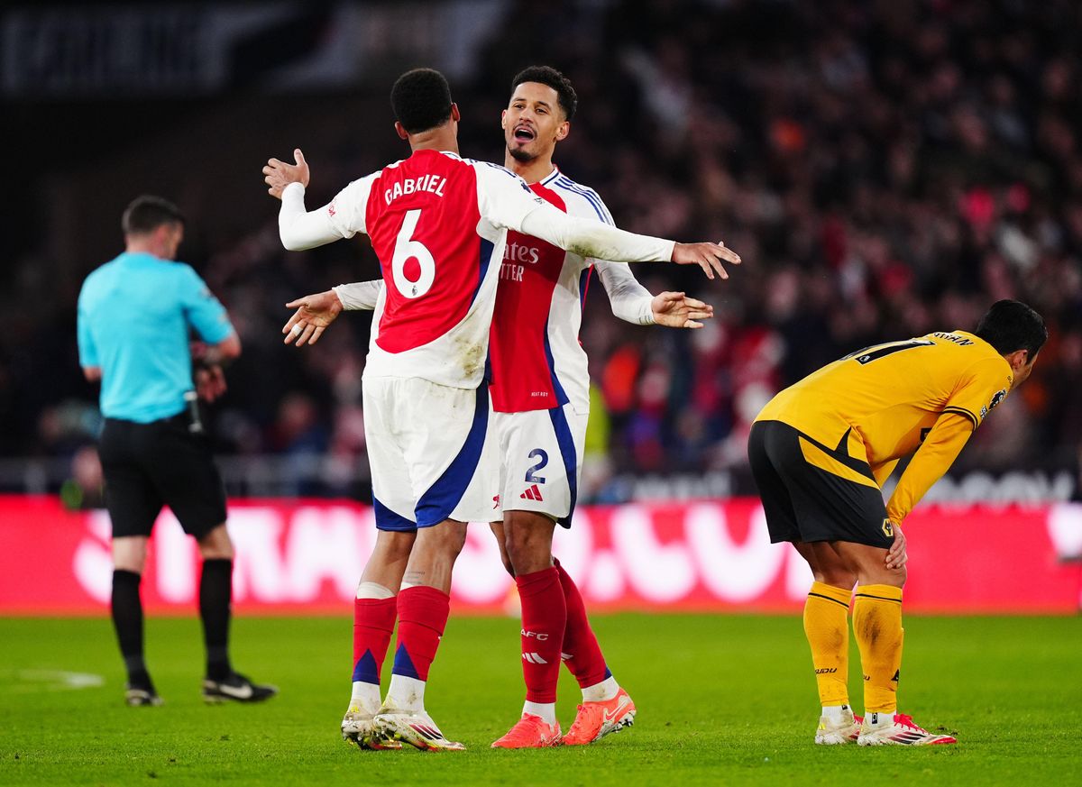 Arsenal&#039;s William Saliba and Gabriel Magalhaes embrace each other in celebration at full-time of the Premier League match against Wolverhampton Wanderers at Molineux on 25 January, 2025