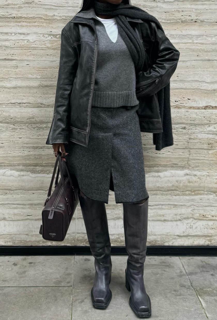 @daniellejinadu wears a distressed leather jacket