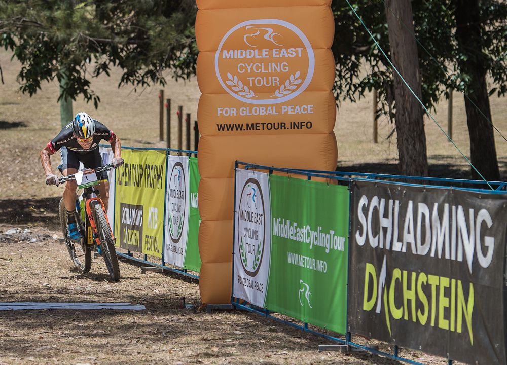 Urs Huber crossing the finish line as the new overall leader in Irvinebank
