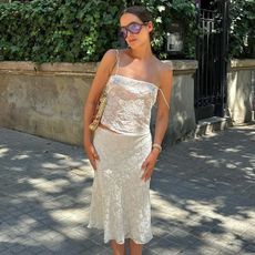 woman in white lace top and skirt