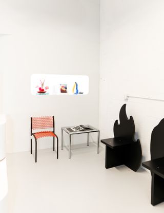 room with chair and black 'flame' shaped chair
