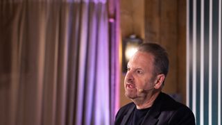 Rene Haas talking at a conference