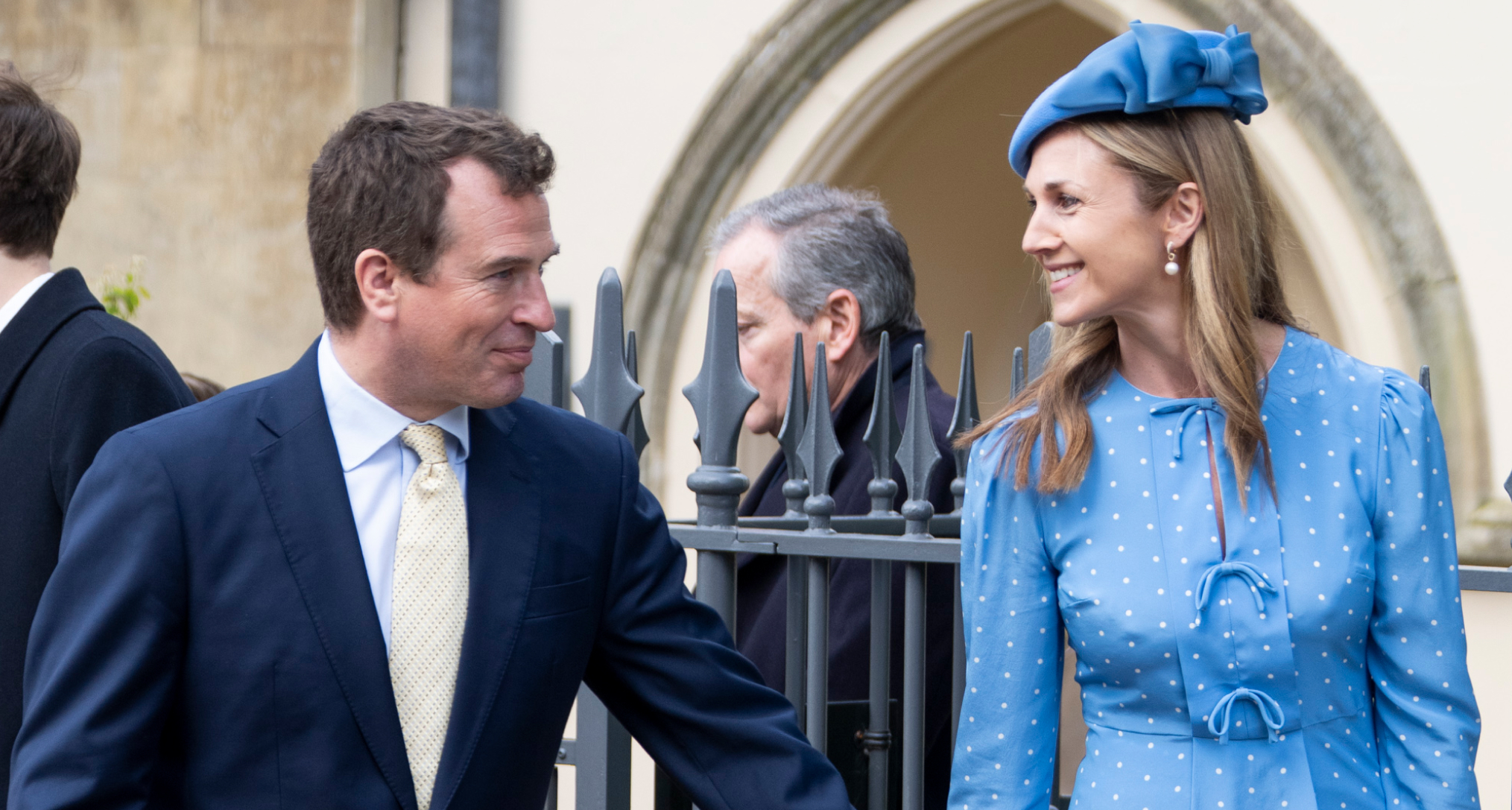 Harriet Sperling and Peter Phillips holding hands outside church