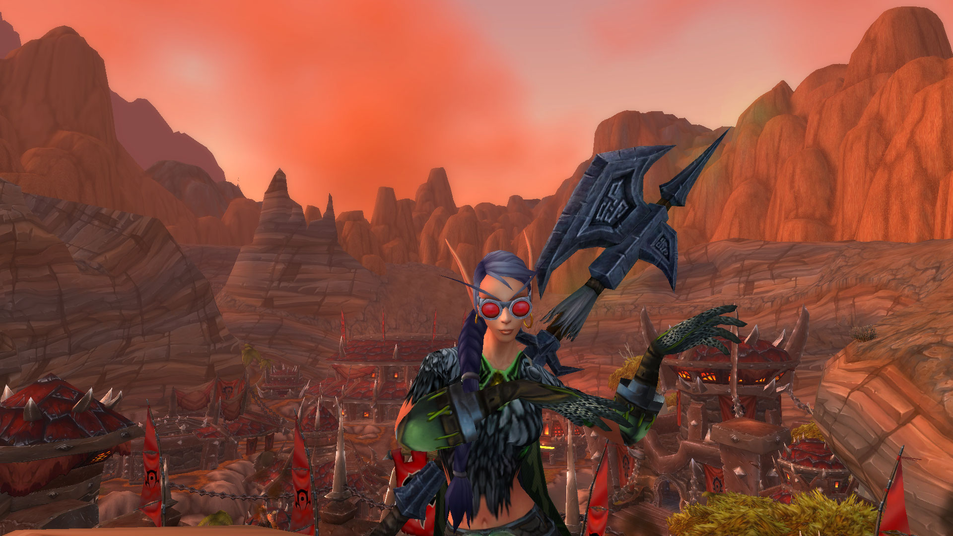 World of Warcraft - hunter character stood in front of a view of Horde capital, Orgrimmar