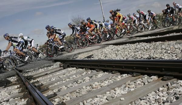 The bunch crosses a rail line.