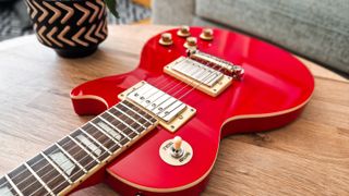Epiphone Power Player Les Paul on a table in living room