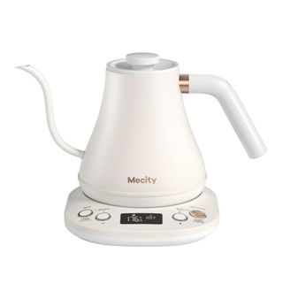A white gooseneck kettle on a warming plate