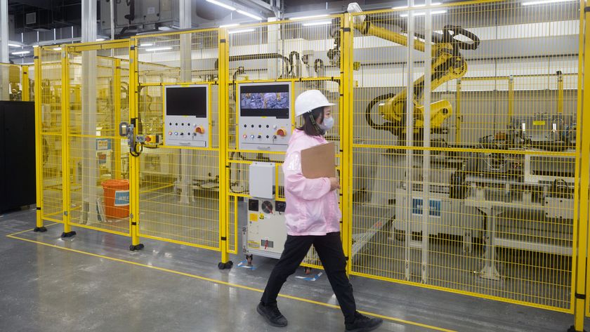 Woman walking past battery testing 