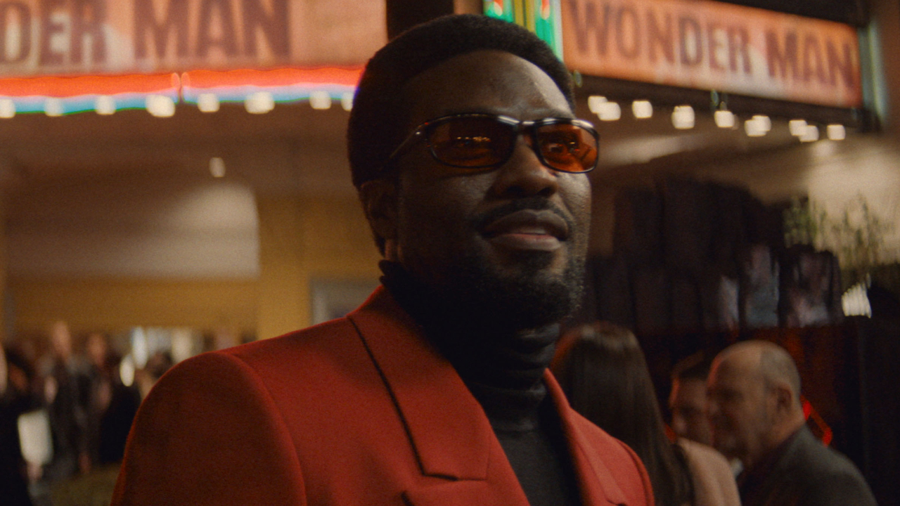 Simon Williams (Yahya Abdul-Mateen II) takes in a movie premiere on Wonder Man.