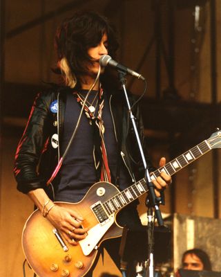 Joe Perry of Aerosmith performs on stage on Day 2 of The Reading Festival on August 27th, 1977 in Reading, United Kingdom. He plays a Gibson Les Paul guitar.