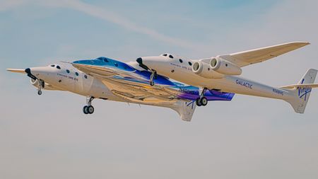 Virgin Galactic's first Delta-class space plane, named Apeiron, takes to the skies for the first time on Oct. 28, 2026, beneath the wings of its carrier plane, VMS Eve.