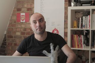Rodrigo Sobral (and a hairy handed assistant) in his office space at The Mill Digital in London