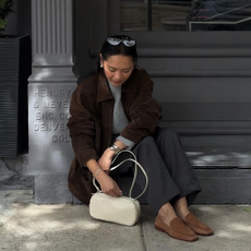 @dawn.tan wearing brown loafers with grey trousers and brown suede jacket