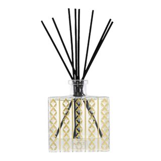 NEST New York Holiday Reed Diffuser in a clear and gold bottle