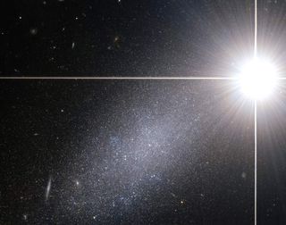 Super Bright Star Outshines Galaxy In Cosmic Photo