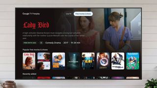 A Google TV showing the Freeplay interface with a catalog of on-demand movies and shows