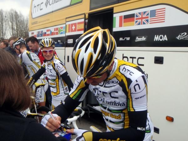 Hayden Roulston (HTC-Columbia) makes a fan's day as Gert Dockx looks pretty pleased to be in Belgium
