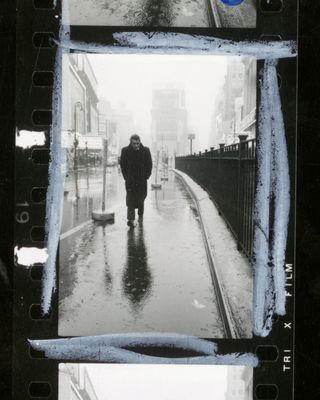 A contact sheet of an image of James Dean walking down times square in the rain wearing a black jacket