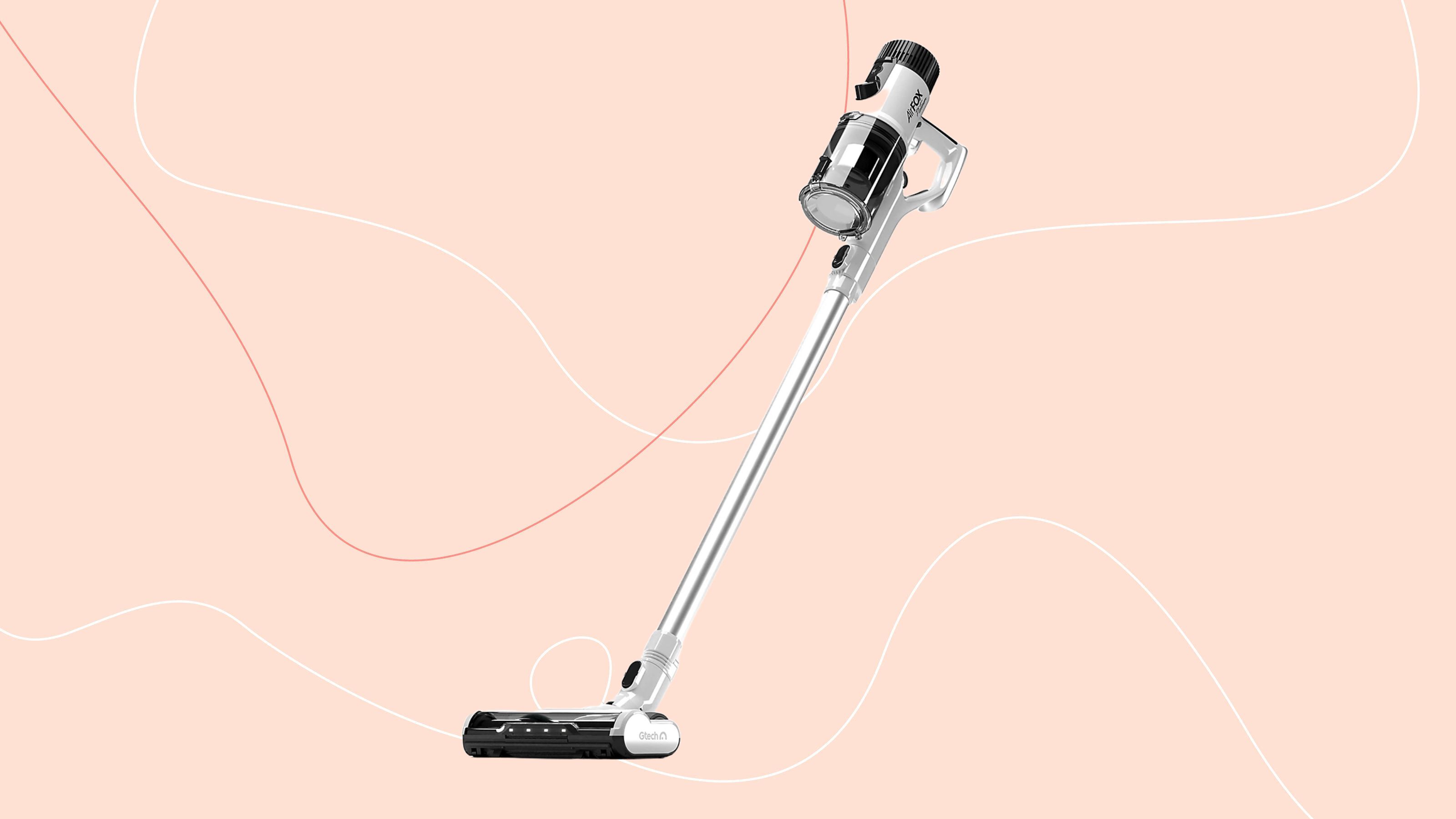 Gtech AirFOX Platinum vacuum on a pink background