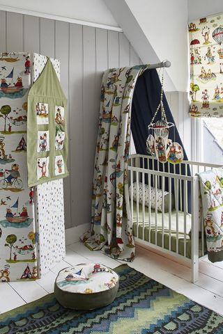 nursery ideas with patterned curtains and an upholstered screen