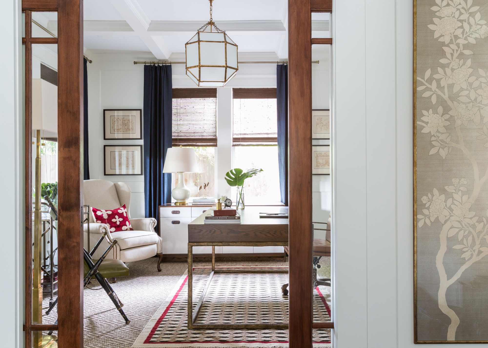 room with sliding glass pocket doors and blue curtains