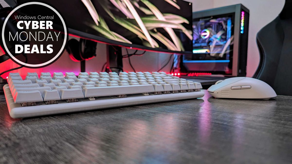 The Alienware Pro Wireless Gaming Keyboard and Mouse, in white, sitting on a desk.