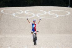 ELANCOURT FRANCE JULY 28 Pauline Ferrand Prevot of Team France celebrates at finish line as race winner during the Womens CrossCountry Cycling Mountain Bike Gold Medal race on day two of the Olympic Games Paris 2024 at Elancourt Hill on July 28 2024 in Elancourt France Photo by Jared C TiltonGetty Images