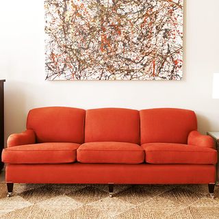 living room with red sofa