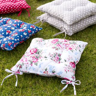 green grass with comfy cushions