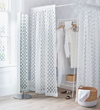 curtain with white colour and hanging white cloths