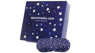 Dark blue box with stars on and an eye mask