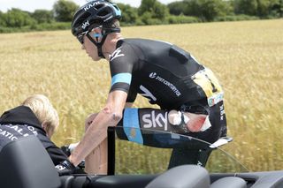 Chris Froome gets treatment after a crash on stage four of the 2014 Tour de France