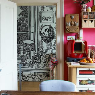 kitchen corner with wall drawn with black marker pen and pink wall