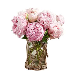 Pink peony bouquet in a woven vase